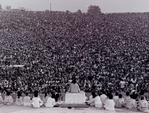 Courtesy photo Swami Satchidananda addressing an overwhelming crowd during Woodstock's opening ceremony.